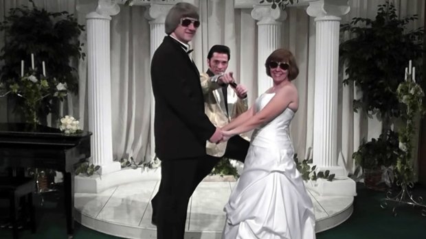 David Turpin, left, and his wife Louise celebrate a renewal of their wedding vows with Elvis impersonator Kent Ripley in Las Vegas in 2011. 