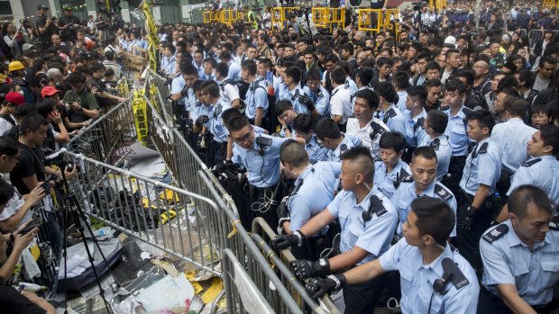 Police near a barricade on Nathan Road in Mong Kok.