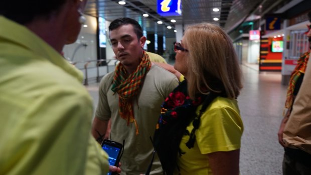 Julia Dyball and Michele Harding greet anti-Islamic State fighter Ashley Dyball who  returned to Melbourne on Monday 7 December 2015. Photo: Luis Ascui