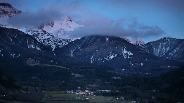 Night falls on the alps near the area where the plane crashed.