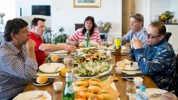 Jean-Claude Van Damme dines with Steve Radford, left, and friends.