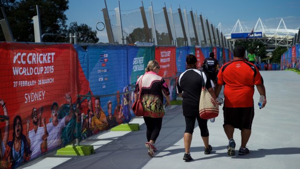 Pedestrians using the Albert Tibby Cotter Bridge over Anzac Parade during the world cup.