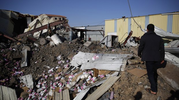 A worker walks on the rubble of a food factory destroyed by Saudi-led airstrikes in Sanaa earlier this month. The United Nations has suggested that such airstrikes may amount to war crimes, and has also accused the Houthi rebels of such crimes.
