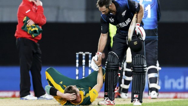 Magic moment: New Zealand's Grant Elliot extends a hand to South Africa's Dale Steyn.