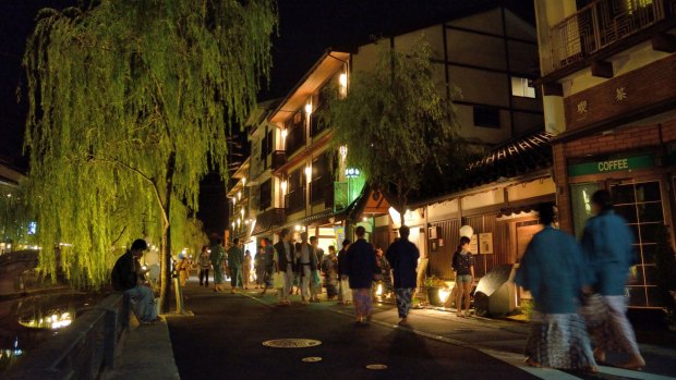 Strolling between onsesn in Kinosaki Onsen.