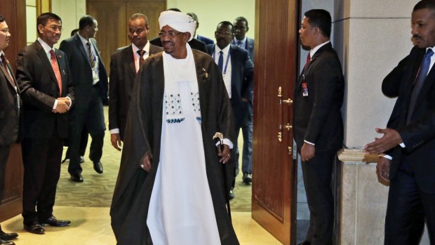 Sudan's President Omar al-Bashir leaves after a bilateral meeting with Indonesian President Joko Widodo on the sidelines of  the Organisation of Islamic Cooperation (OIC) summit in Jakarta. 