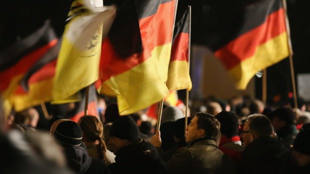  Supporters of the Pegida movement march in Dresden.