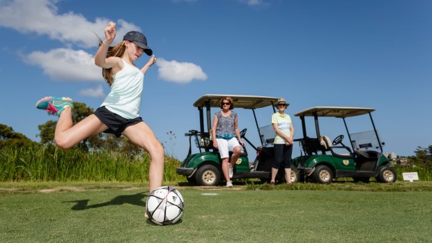 Emily Smith leans into a tee shot playing FootGolf at Northbridge Golf Club. 