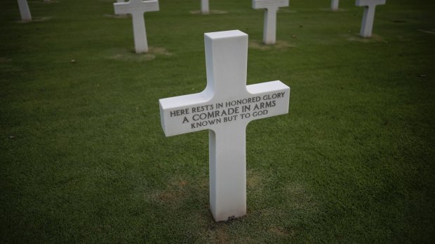 A white marble cross at grave J-7-20 bears the words: "Here rests in honored glory a comrade in arms known only to God."