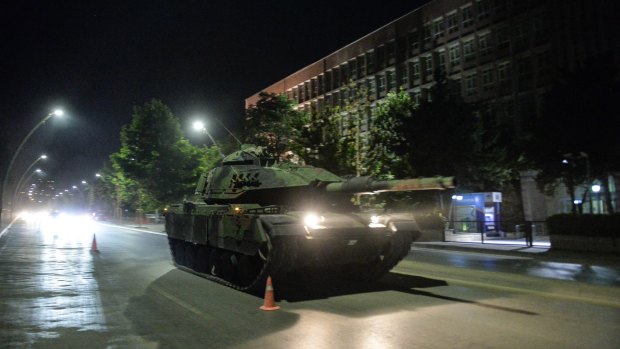 Turkish army tanks move in the main streets of Ankara in the early morning hours of  Saturday.