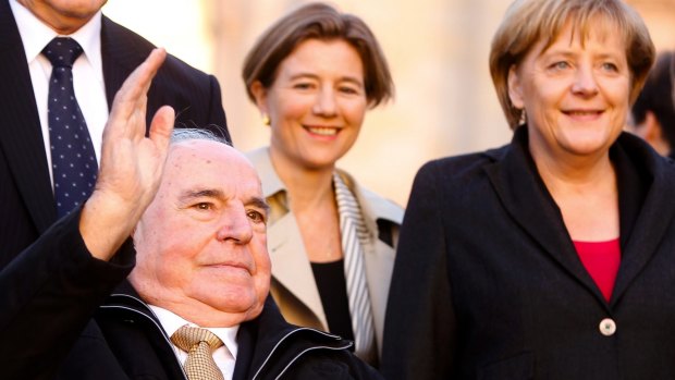 Former German Chancellor Helmut Kohl and current German leader Angela Merkel mark the 20th anniversary of Germany's reunification in Berlin in 2010.
