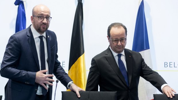 Belgian Prime Minister Charles Michel, left, with French President Francois Hollande at Mr Michel's office in Brussels on Friday.