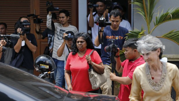 Majell Hind (right), Australia's consul-general in Bali,  accompanies Raji Sukumaran (centre), mother of  Myuran Sukumaran, as they leave Kerobokan prison on Sunday.