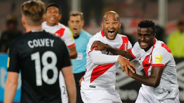 Breakthrough: Peru's Christian Ramos, (right) after scoring against New Zealand.