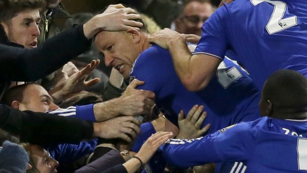 You ought to be congratulated: Chelsea's captain John Terry jumps into the crowd as he celebrates scoring his side's third goal.