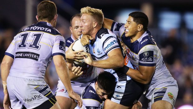 Wrapped up: Matt Prior of the Sharks is tackled at Southern Cross Group Stadium.