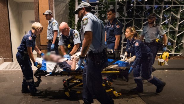 NSW Ambulance paramedics and police officers perform CPR on a 49-year-old man who collapsed having suffered a cardiac arrest.