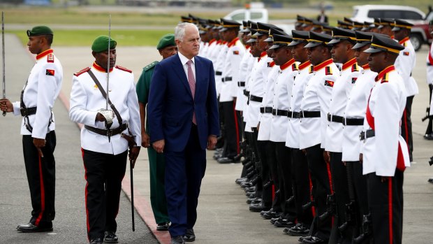 Prime Minister Malcolm Turnbull inspects the military guard as he departs Papua New Guinea for India.