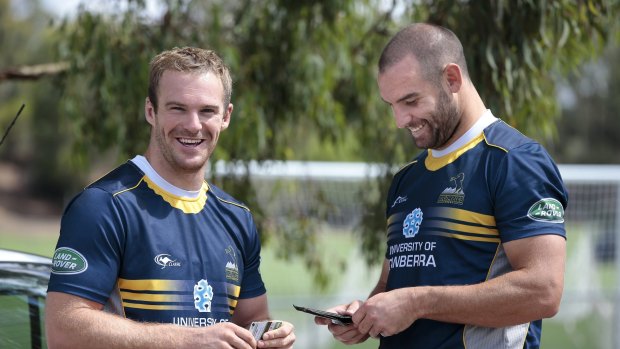 Buddies: ACT Brumbies players Pat McCabe and Scott Fardy share a laugh following a training session in 2014.