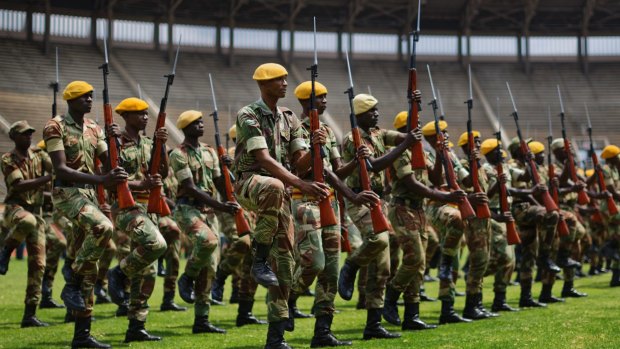 Zimbabwean soldiers prepare for Friday's presidential inauguration of Emmerson Mnangagwa, at the National Sports Stadium in Harare, Zimbabwe.