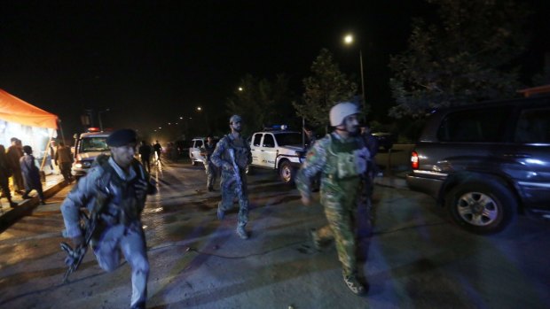 Afghan security forces rush to respond to the attack on the university.