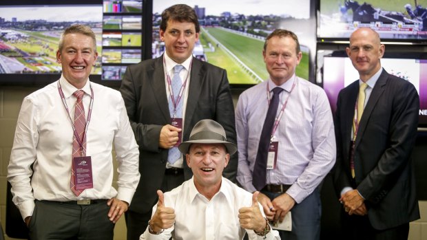 Retiring jockey Jim Cassidy (seated) with stewards (from left) Rob Montgomery, Terry Bailey, Robert Cram and Kim Kelly at Flemington in November 2015.