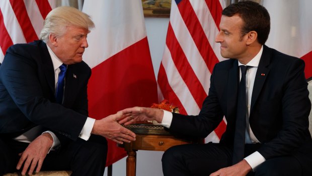 That handshake: US President, Donald Trump, and French President, Emmanuel Macron, at the US Embassy in Brussels in May.