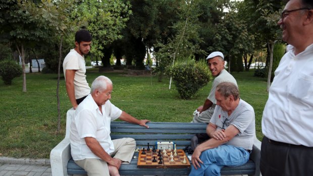 People play chess in a park in Tashkent, Uzbekistan on Tuesday.