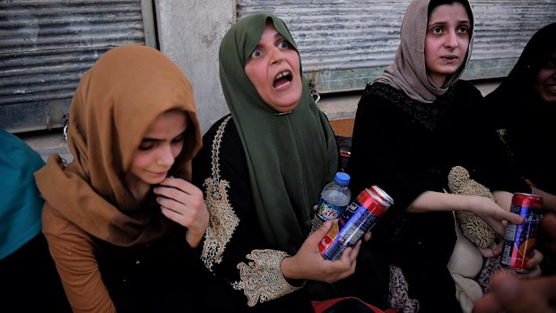 Emotional scenes moments after families arrive at a screening point in west Mosul after being rescued by Iraqi forces from Islamic State-held areas. 