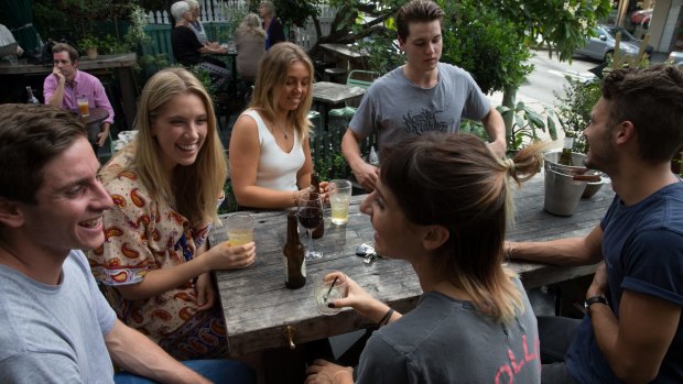 Clockwise from left:  Lachy Borg, 19, Carly Boscheinen, 19, Jayme-Lee Fechner, 19, Dom Caillard, 20, Oliver Champion, 20, and Nicoletta Mancuso, 19, enjoying a drink at The Cottage in Balmain, Sydney.