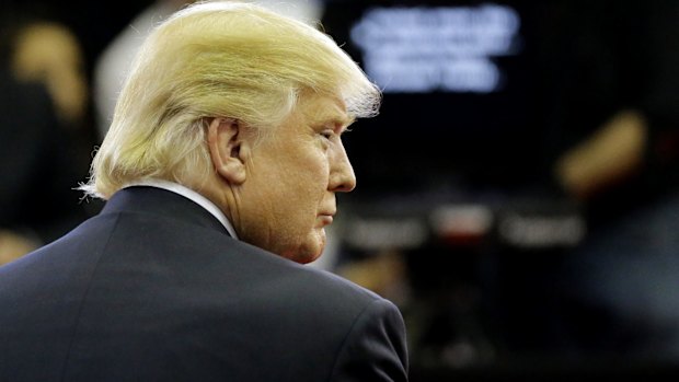 Republican presidential candidate Donald Trump pauses in the Spin Room after a Republican presidential primary debate at the University of Houston, Texas. 