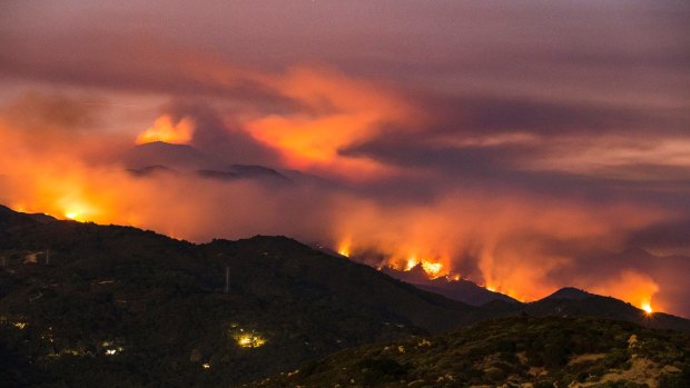 Fire burns in the mountains west of Santa Barbara, California on Sunday.