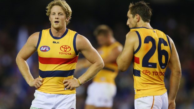 Free for all: Rory Sloane and Richard Douglas after Saturday night's game.