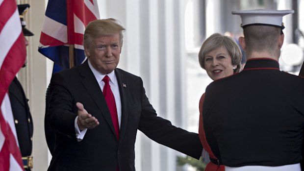 Donald Trump, left, welcomes Theresa May to the West Wing of the White House.