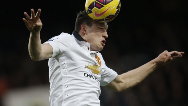 Up in the air: Phil Jones heads the ball at Upton Park at the weekend.