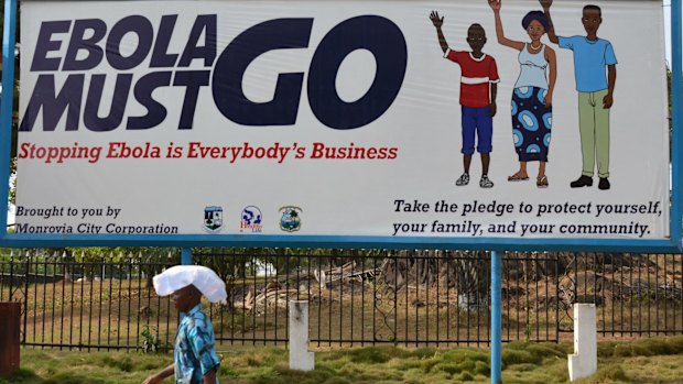 An ebola campaign banner with the new slogan "Ebola Must GO" in Monrovia, Liberia, in February this year.