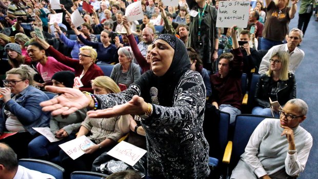 Noor Ul-Hasan reacts during Republican Jason Chaffetz's town hall meeting in Cottonwood Heights, Utah. Utah refugee officials and Muslim advocates said the revised travel ban doesn't alleviate their concerns about an initiative they contend unfairly targets refugees and Muslim countries. 