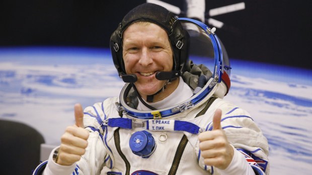 British astronaut Tim Peake gestures prior to the launch of Soyuz TMA-19M space ship at the Russian-leased Baikonur cosmodrome in Kazakhstan on December 15, 2015.