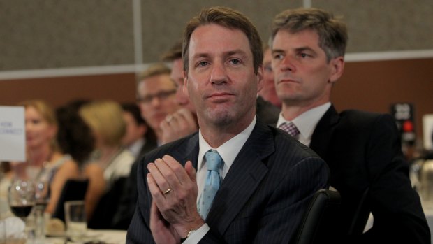 From journalist to spinner ... Mark Simkin applauds as Prime Minister Tony Abbott takes the stage to address the National Press Club of Australia in Canberra.