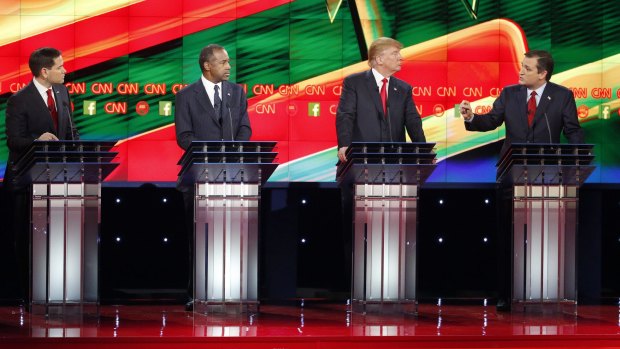 Ted Cruz, right, speaks during an exchange with Marco Rubio, left, as Ben Carson, second from left, and Donald Trump look on. 