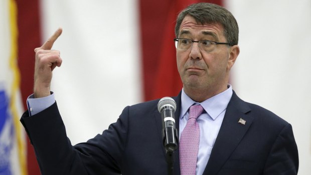 US Defence Secretary Ash Carter gestures while addressing US military personnel at the Osan Air Base in Pyeongtaek, south of Seoul.