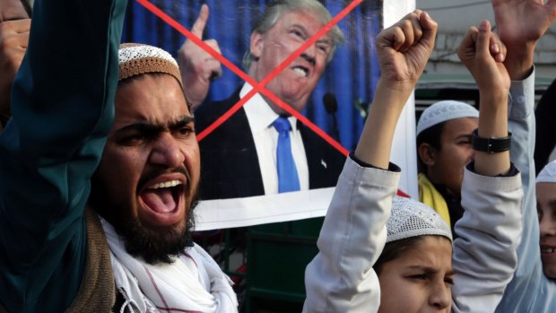 Pakistani religious students protest against US President Donald Trump in Lahore, Pakistan, on Friday.