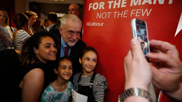 Jeremy Corbyn, leader of the UK opposition Labour Party, poses for a photograph with supporters after delivering a speech on Brexit negotiations in London.