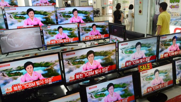 TV screens at a Yongsan Electronic shop showing a news bulletin about the North Korean missile test.