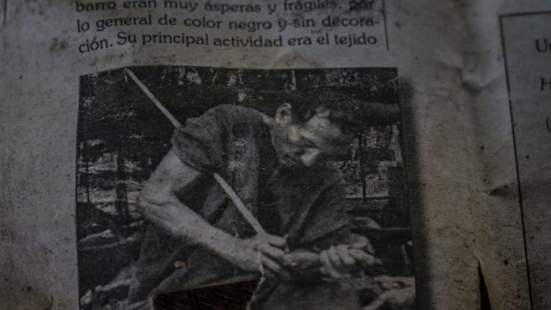A photo of Garcia's late father in an old Peruvian history book that Amadeo keeps as one of the last photos of his family.
