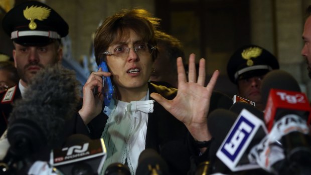 Giulia Bongiorno, the lawyer of Raffaele Sollecito, talks with media after the announcement of the shock verdict in front of the Palace of Justice in Rome on Friday.