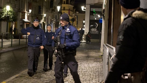 Police patrol in central Brussels on Sunday.