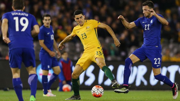 Tomas Rogic of the Socceroos and Andreas Samaris of Greece compete for the ball.