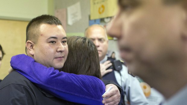 La Loche mayor Kevin Janvier and legislator Georgina Jolibois hug after speaking with media about the ongoing investigation of the shooting.