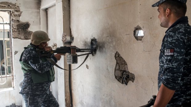 Iraqi Federal Police soldiers in Adedat, in the Old City of west Mosul, the last area of the city under IS control, on Thursday.